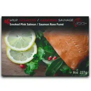 Premium smoked pink salmon with lemon slices and greens, Canadian gourmet seafood.